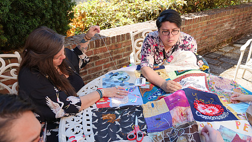 Members of Art for Social Change met to work on the Pandemic Quilt