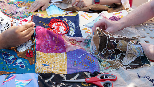 Members of Art for Social Change met to work on the Pandemic Quilt