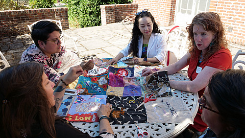 Members of Art for Social Change met to work on the Pandemic Quilt