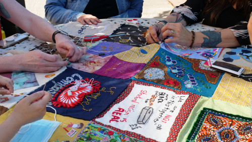 Members of Art for Social Change met to work on the Pandemic Quilt