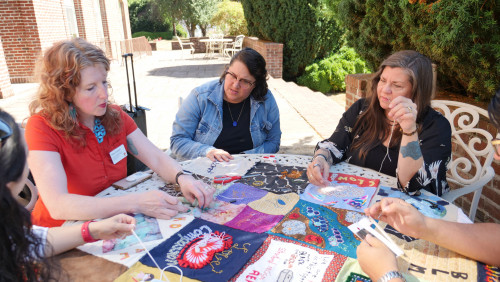 Members of Art for Social Change met to work on the Pandemic Quilt