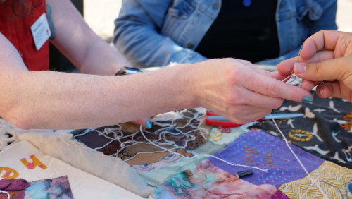 Members of Art for Social Change met to work on the Pandemic Quilt