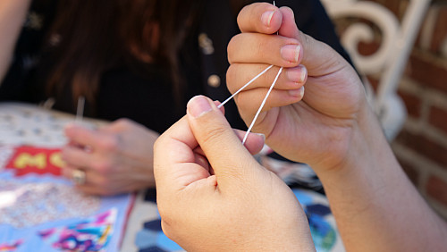 Members of Art for Social Change met to work on the Pandemic Quilt