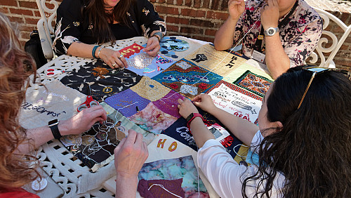 Members of Art for Social Change met to work on the Pandemic Quilt