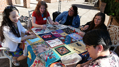 Members of Art for Social Change met to work on the Pandemic Quilt