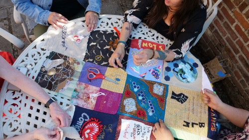 Members of Art for Social Change met to work on the Pandemic Quilt