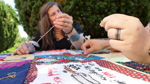 Members of Art for Social Change met to work on the Pandemic Quilt