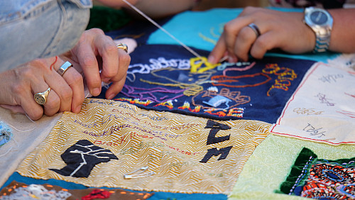 Members of Art for Social Change met to work on the Pandemic Quilt