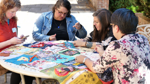 Members of Art for Social Change met to work on the Pandemic Quilt