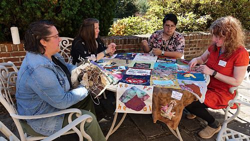 Members of Art for Social Change met to work on the Pandemic Quilt