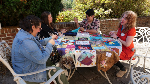 Members of Art for Social Change met to work on the Pandemic Quilt