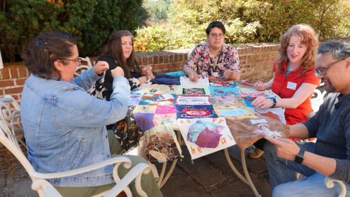 Members of Art for Social Change met to work on the Pandemic Quilt