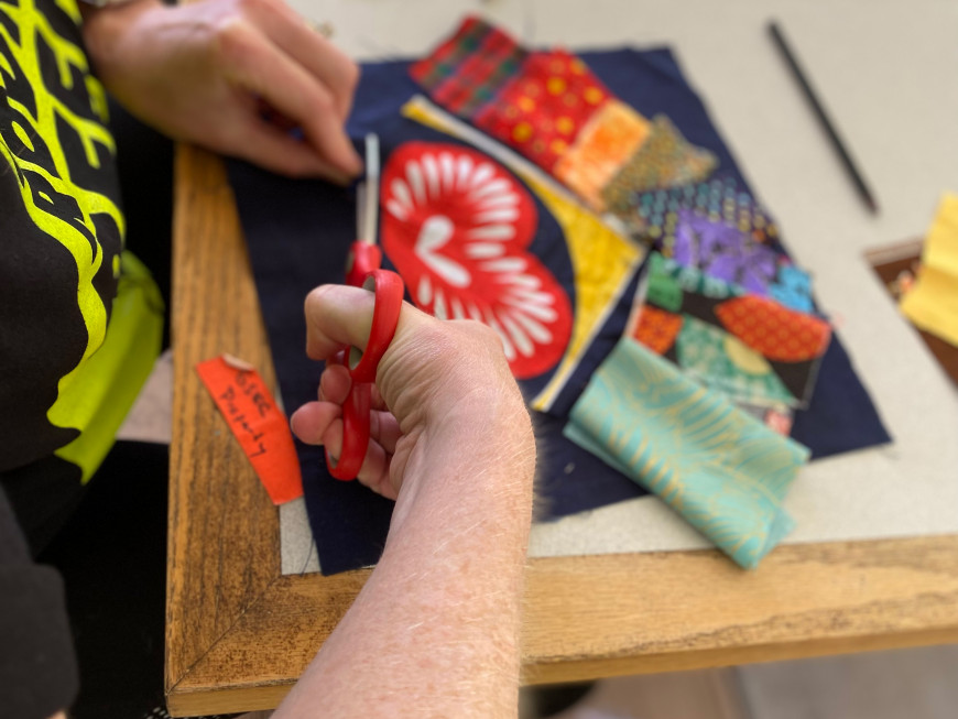 Mary Andrus planning out a quilt square design.