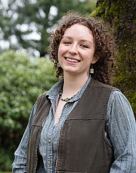 Environmental studies major Izz helped create the Community Food Cabinet through the ReUse Room, and is working on a composting system fo...