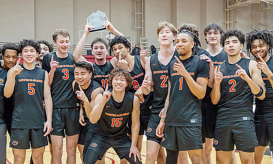 Men's basketball team celebrating their win.