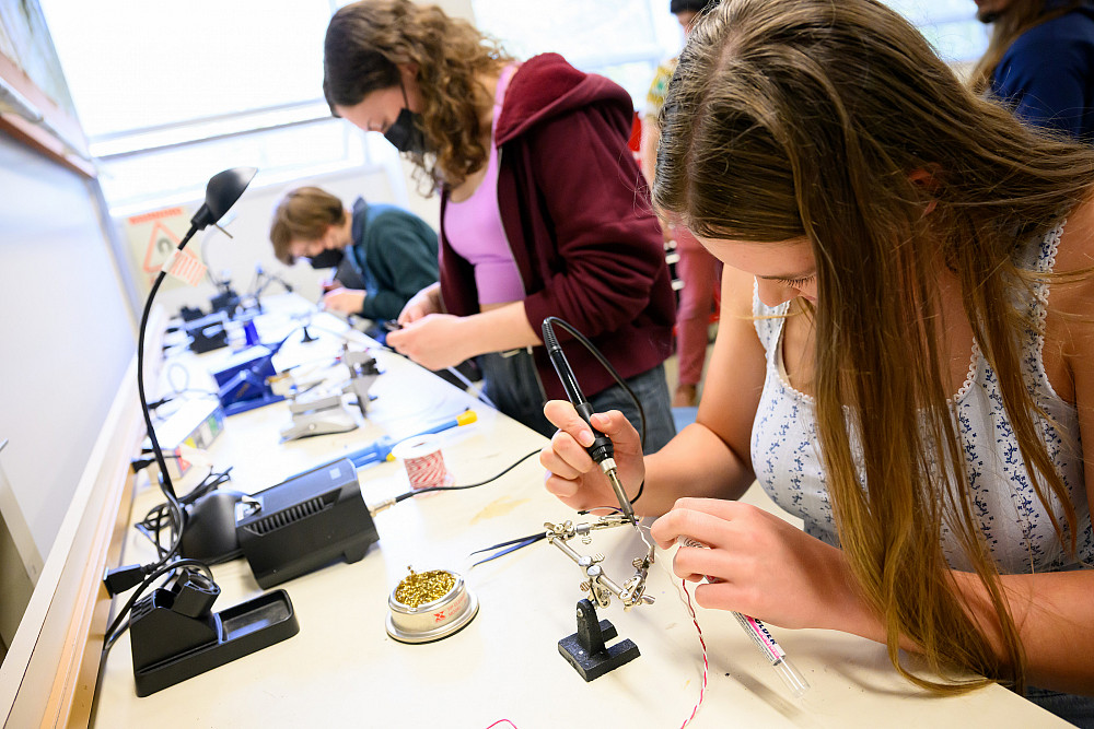 Students working at a lab table.