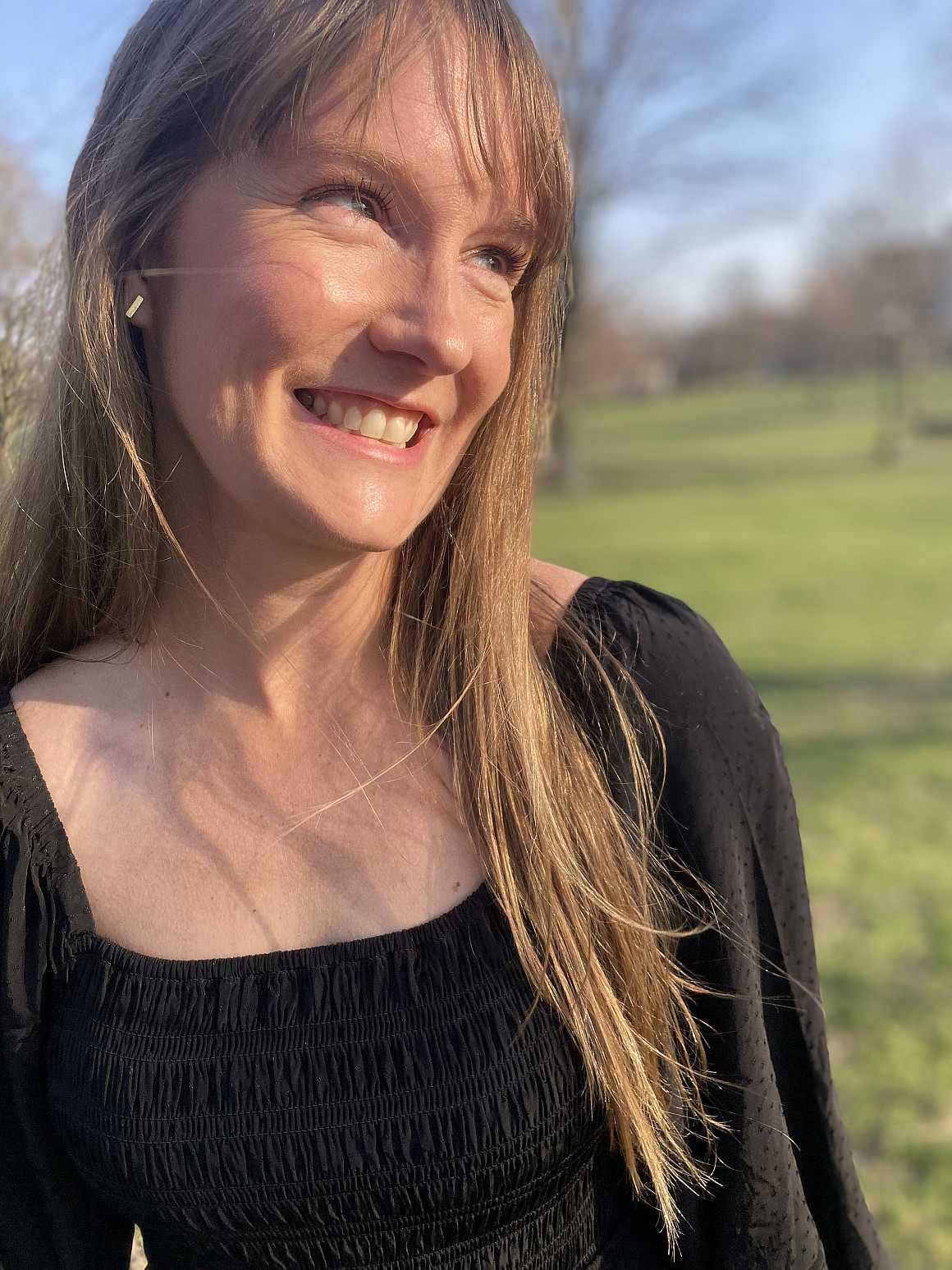 Corey looking off camera, smiling.