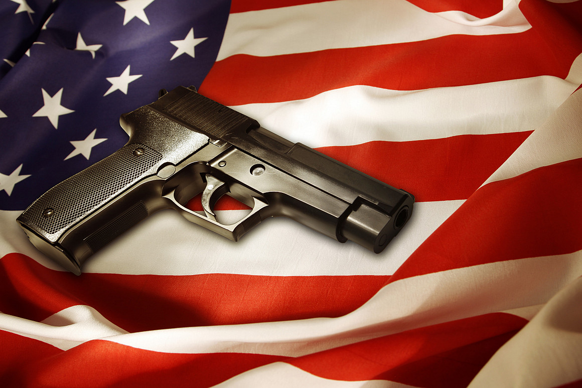 Handgun lying on American flag