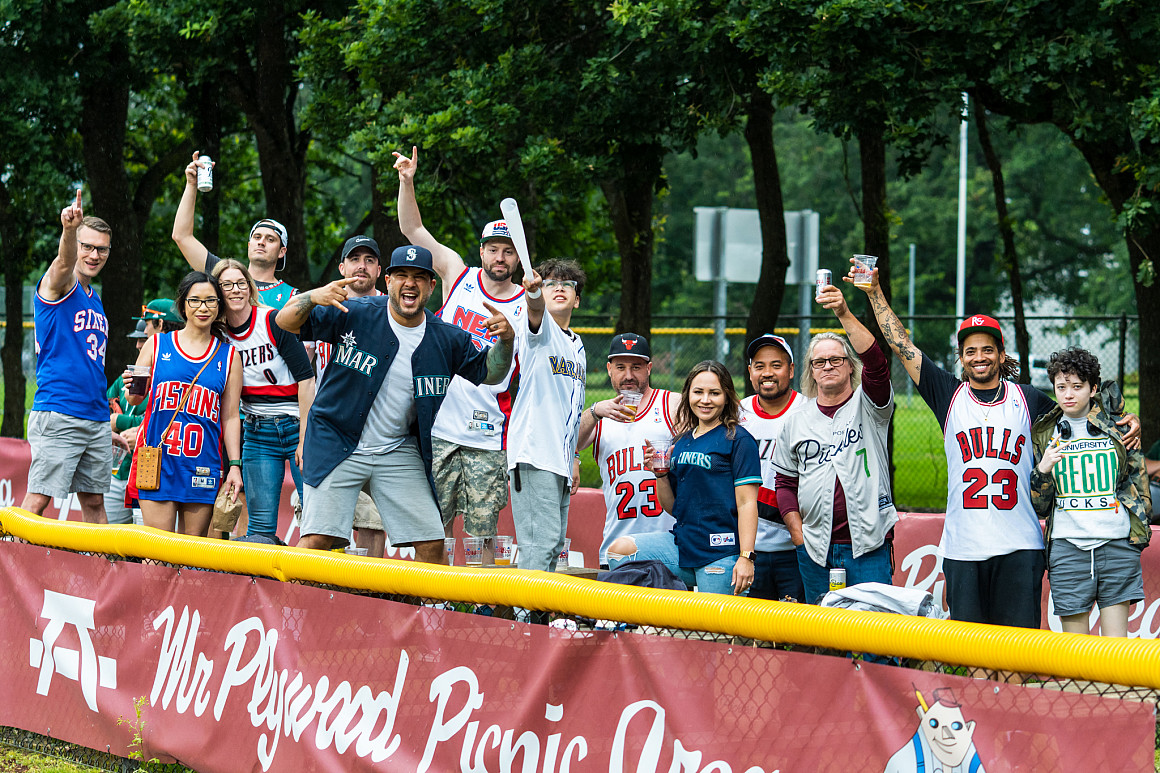 A large crowd of spectators cheering.