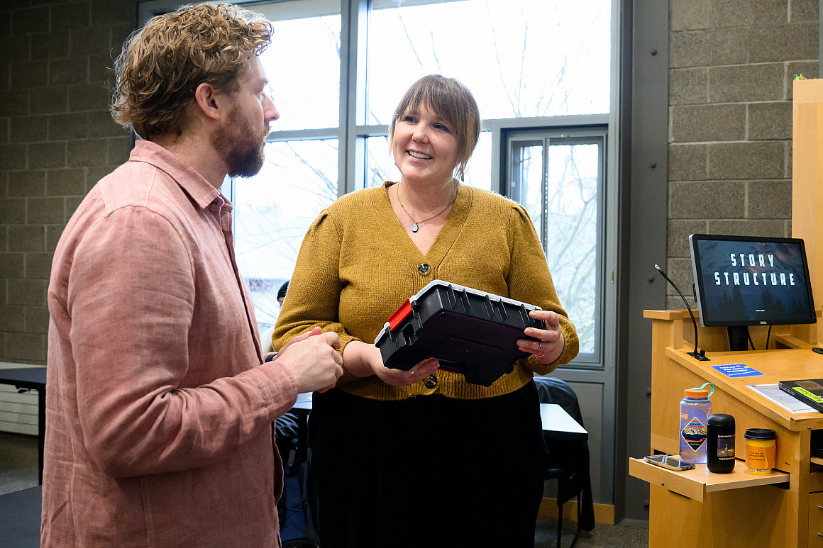 Jolina Ruckert, who teaches Psychology of Gender, talks with Story Gorge workshop leaders Kyle Glenn (left) and Sean O'Connor.