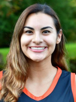 Gabby smiling at the camera, wearing her L&C athletics gear.