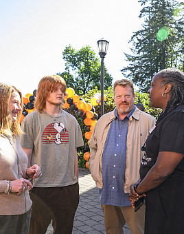 President Robin Holmes-Sullivan (right) connecting with new students and families at New Student Orientation.