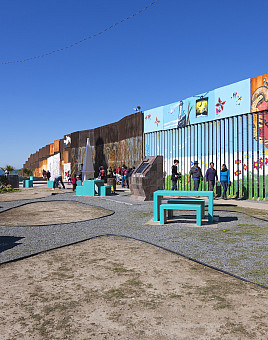 Playas de Tijuana, Mexico - January 28, 2017: The wall separating Mexico and the United States is a richly decorated mural stirring deep ...