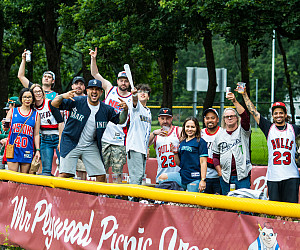 A large crowd of spectators cheering.