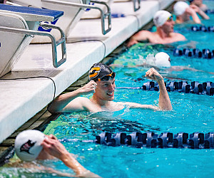 Ezra celebrating in the pool after a win.