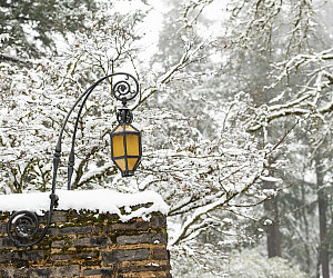 Exterior winter shot of campus with snow on the wall.