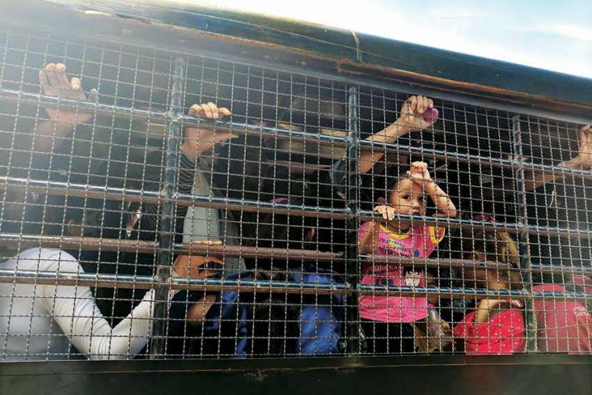 A photo taken by Bylander of a vehicle packed with Cambodian migrant workers and their children arriving at the Poipet border crossing.