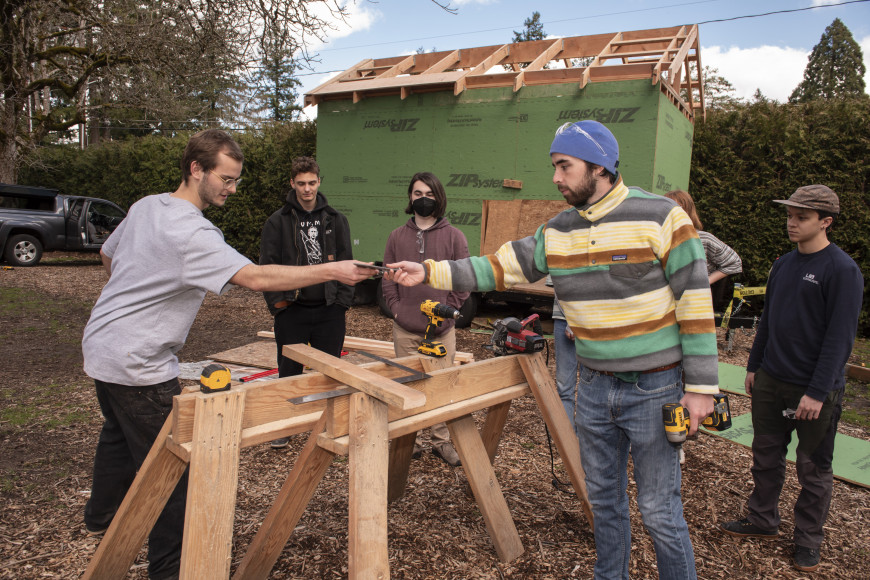 Students support and learn from one another while working on the house