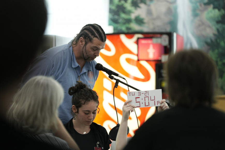 Inside student speaking into a microphone.