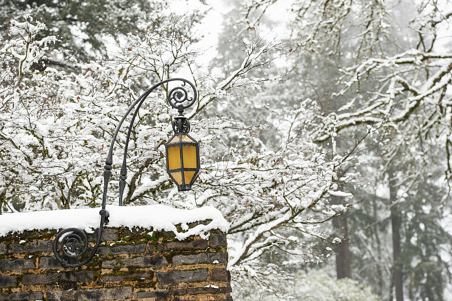 Exterior winter shot of campus with snow on the wall.